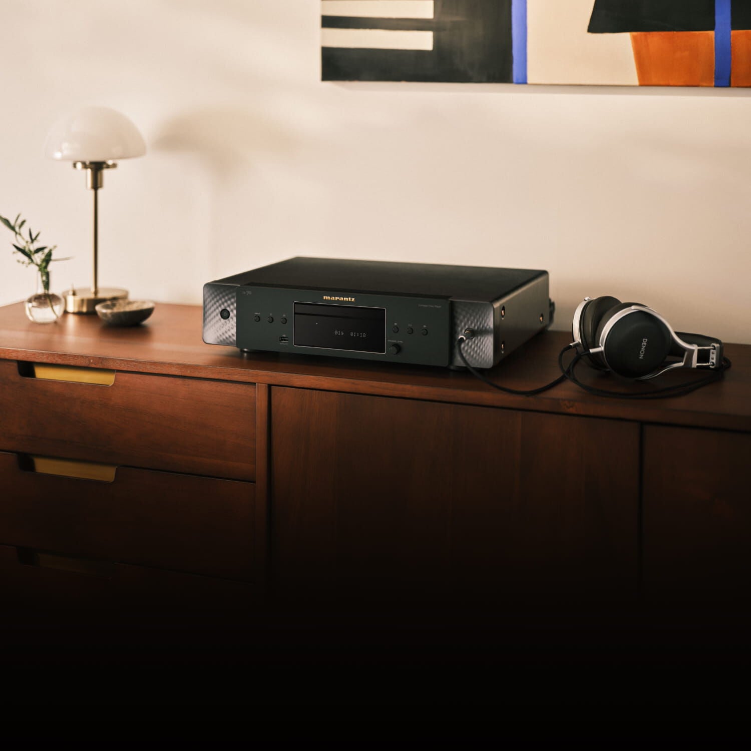 CD 70 Black sitting on a dresser with a lamp