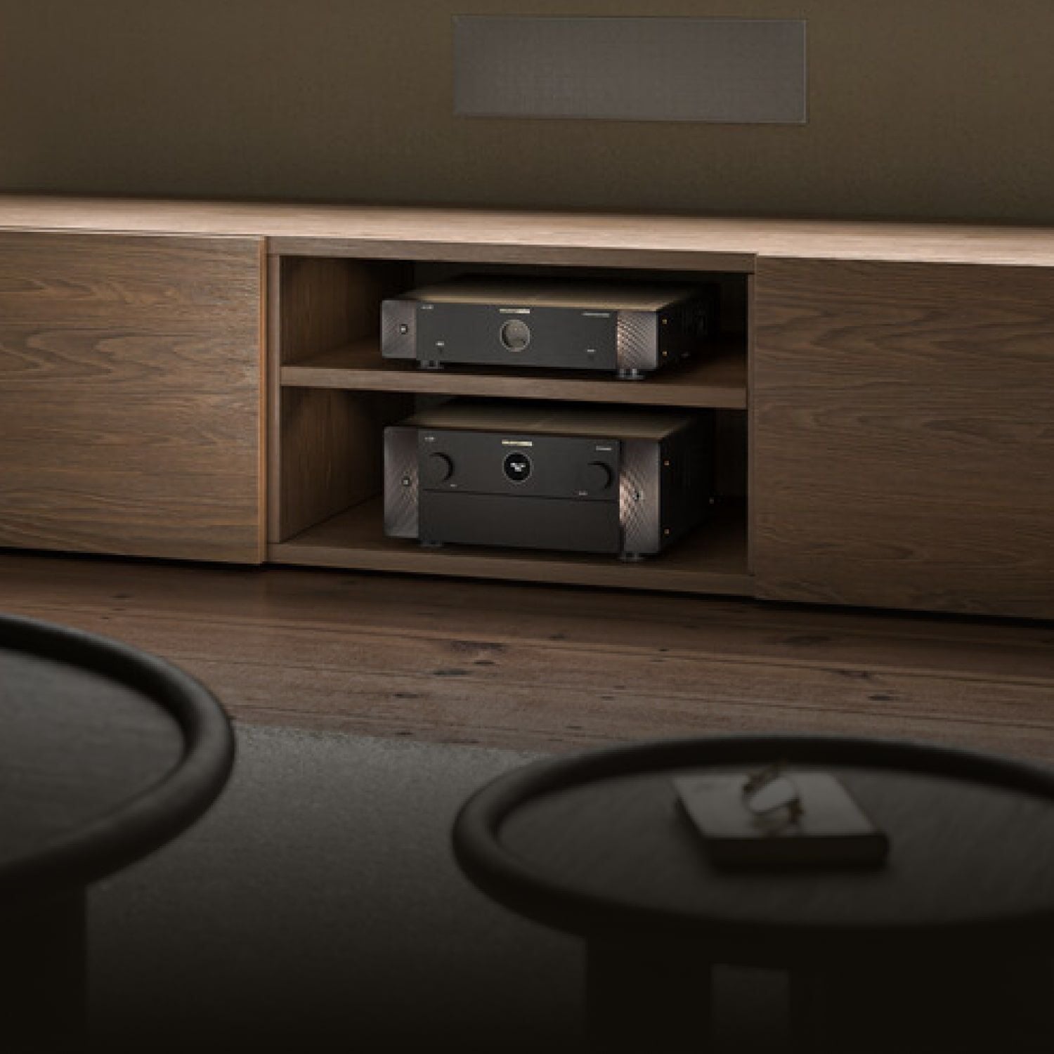 Black AMP30 sitting inside media console in living room