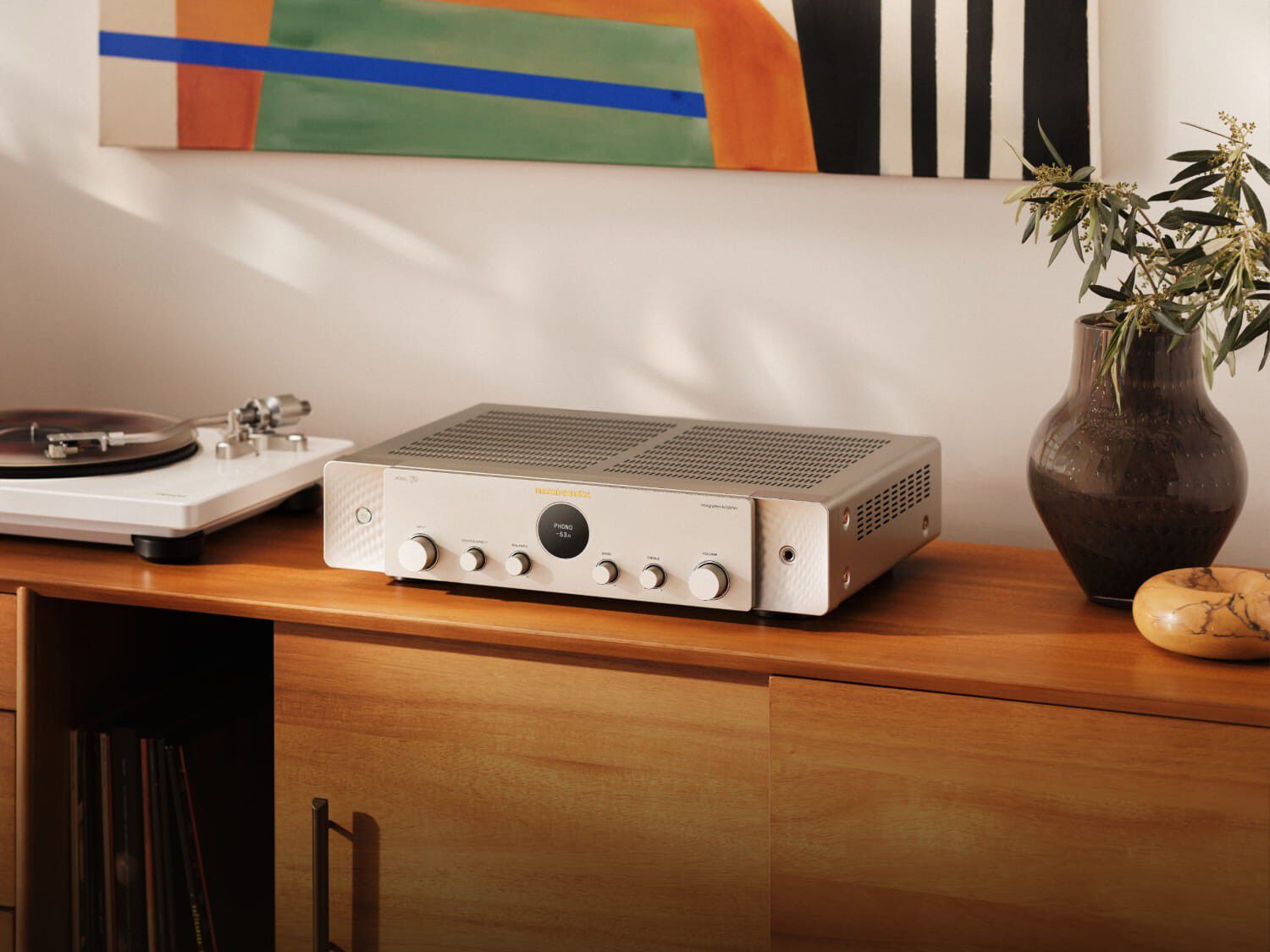 Silver-gold Model 70 on counter next to cd player
