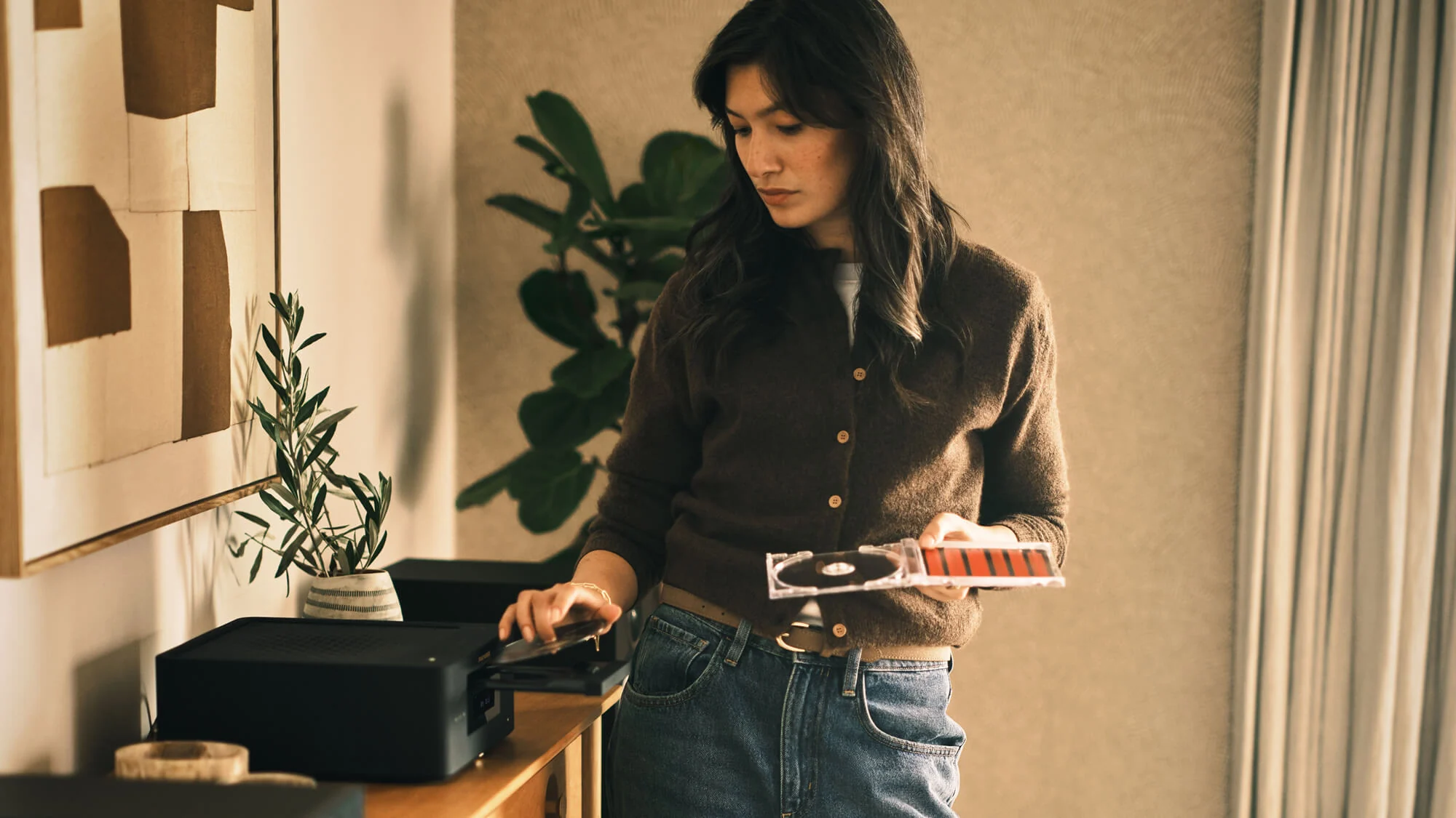 Woman putting CD into black MCR 60n